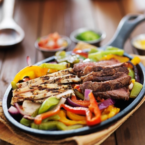 sizzling fajitas chicken and beef and peppers